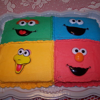 Sesame Street Chocolate cake/Vanilla buttercream frosting. Sesame street face toppers.