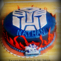 Transformers Autobot Birthday Cake This was the second cake that I have made. Butter yellow cake with cream cheese icing. Airbrush effect with homeade MMF accents. Obviously...