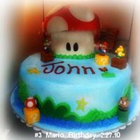 Mario Birthday This was my third cake that I made... From this cake, i learned to not use fondant in a house that is warm... awful! The cake almost fell...