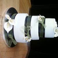 Calla Lily Wedding 10,8,6 BC with gumpaste calla. The black ribbon is a ribbon and the sheer green is tied around the black...she didn't know what she...