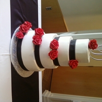 My First Wedding Cake 12,10,8,6 BC with gumpaste roses. My first ever wedding cake! They were very happy! And nothing major happened--so I was happy too!