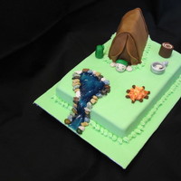Camping Cake french vanilla cake with icing fillingtent is made of cake - all covered in fondant fire, pot, stump, back pack and man made of 50/50...