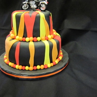 Harley Davidson Cake/stag & Doe stag & doe cake bottom tier red velvet cake with buttercream icingtop tier is mocha cake with chocolate mocha icing covered in black...