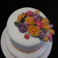 Wedding Cake bottom tier chocolate cake top is vanilla cakefondant flowers