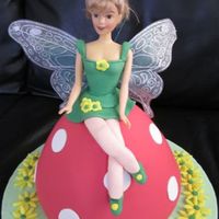 Tinkerbelle Chocolate mudcake covered in white choc ganache and coloured fondant.