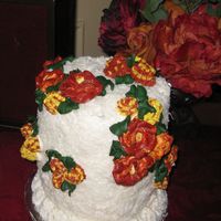 Tropical Flowers Coconut cake embellished with tropical colored buttercream flowers.