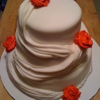 My First Attempt At A Wedding Cake This cake was made for a mock wedding that I had to do for a group project at school. I'm still learning how to make proper roses. I...