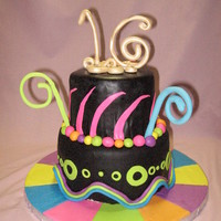 Sweet 16 Nefgaby's chocolate mmf with Macsmom's mmf and gumpaste accents. White cake with oreo filling.
