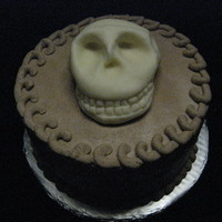 Skull Cake This cake was for a little boy's birthday. He said he wanted a skull cake (this one is white chocolate candy clay).