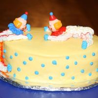 Clown Cake Wilton Course 1, Cake 2I know the clown on the side is very long and skinny, but it was my first time:) Plus I did not have enough icing...