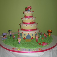 Strawberry Shortcake Birthday cake for a two yr. old, ribbon trim. Client provided the figurines.