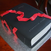 Eclipse Book Eclipse Book made from a 8 x 10 sponge cake. Whole cake was covered in white fondant and then I made the book cover with black fondant....