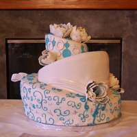 Topsy Turvy Teal This was my first wedding cake, my first three tier topsy turvy, only my second ever topsy turvy, first draping, and first peonies. SO MUCH...