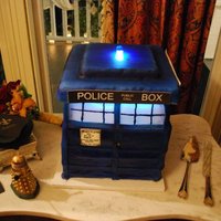 Tardis TARDIS (from Dr. Who) Groom's cake. Chocolate cake with Jameson chocolate ganache. Electrically lit in two places, which was a...
