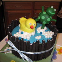 Frog & Duckie Baby Shower Cake Top tier is chocolate cake with strawberry buttercream filling and vanilla buttercream icing. Covered with fondant, sides are "Oreo...