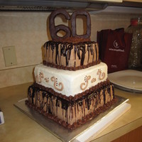 Randy's 60Th Top layer is chocolate cake with chocolate cream cheese icing. Middle layer is chocolate cake with cream cheese icing. Bottom layer is...