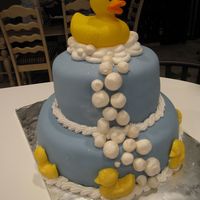 Rubber Ducky... French vanilla cake, cherry filling, buttercream, topped with fondant. Bubbles are royal icing, rolled in luster dust. The duckies along...
