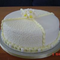 For My Nieces Bridal Shower Chocolate cake covered with fondant and frangipani flowers on top made from gumpasste. It was also her birthday the same day.