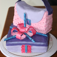 Gift Box And Purse Cake I made this for my 8 yr. step-daughter's birthday. Overall I think it came out ok but I had major problems with this cake in the...
