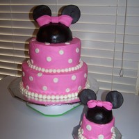 Minnie Mouse Birthday For a little girls first birthday. White cake, strawberry filling, butter cream, and fondant accents.