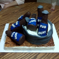 Beer Bottle Cake This was for a birthday. It was all edible. The beer bottles are made out of rice crispies and covered in molding chocolate (I couldn'...