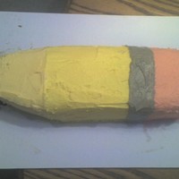 Pencil Cake This was a butter cake with chocolate ganache filling and buttercream on the outside. I forgot to put the foil on the board and my son...