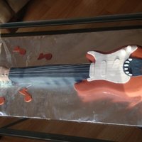 Rock On This cake was made for a very musical 4 year old. I named the guitar after him. Everything but the strings (which are strings) is fondant...