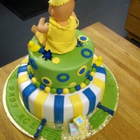 Baby Shower Multi Tiered Cake All fondant and gumpaste. Clothing and hat on baby doll is all fondant.