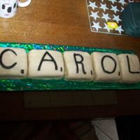 Scrabble Cake Simple Pimple! Cut up a large chocolate sponge into equal squares to form "tiles" jam, cover in marzipan and make simple fondant...