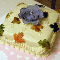 Spring's Revenge Aptly named due to the fact I have a very out of place purple 'fantasy flower' made in the Wilton class that I stuck on top of my...