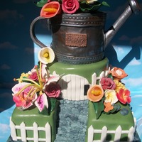 Gardeners Paradise Birthday cake for my Aunty's 70th suprise birthday. Flowers are gumpaste cake is fondant. Ispired by Tonedna of course! Thanks Edna,...