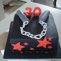 30Th Birthday This was a 30th birthday cake with a theme of martial arts - so I decided to put a numchuck on the top.