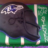Ravens Helmet And Field Cake I made this for a friend's son's birthday. The bottom layer is yellow cake with chocolate ganache (I got both recipes here on...