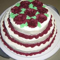 Mock Wedding Cake This is a mock wedding cake I made for a bridal shower. Pineapple cake, canned icing and buttercream icing for the flowers.