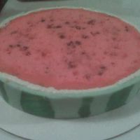 Watermelon Cake White cake colored red with chocolate chips. Green fondant with stripes (drawn by edible marker,) over white canned icing around the edge...