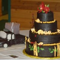 Asian Themed Wedding Cake Gumpaste fortune cookies with real fortunes aswell as bamboos painted with edible gold.Cake was strawberry covered in dark chocolate fudge...
