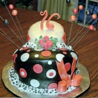 Sweet 16 Whimisical Birthday Cake This cake was designed by the "birthday girl" who was very specific on what she wanted. She loves, roses, orange and black and...