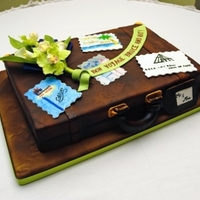 Bon Voyage Groom's Cake "Aged" leather suitcase with miniature of bride's bouquet and travel stickers of places the couple had visited. Triple...