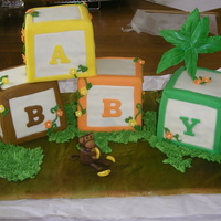 Baby Blocks Shower Cake Baby blocks with monkey and banana's for jungle themed baby shower. Golden cake with dark chocolate ganache filling, french vanilla...