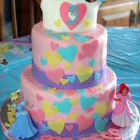 Disney Princess Disney Princess cake. The decor for this party had lots and lots of hearts, so I covered the cake with the same colors in hearts. Crown and...