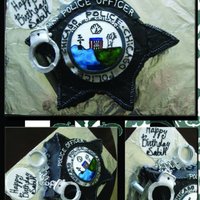 Police Badge My client wanted a replica of a police badge for her fiance's birthday.Covered in buttercream with hand painted emblem.Handcuffs and...