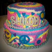 First Birthday This cake was for a friend's little girl on her first birthday. Done in buttercream with mmf accents.