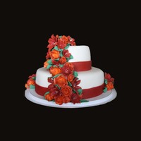 Tiered Fall Cake This is my first tiered cake as well as first attempt at fondant and royal icing flowers. Thanks for looking and I appreciate and comments...