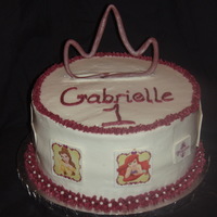 Disney Pricess 10in iced in buttercream. show six disney princesses around side. the princesses are stickers on dried out gum paste(not edible of course)...