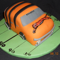 Bengals Tailgate Groom Cake Groom cake covered in fondant. Tiger is Edible Photo. Fondant covered cake board as well. :)