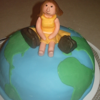 Traveling The World I made this for my husbands co-workers birthday. The cake is covered in fondant and the woman on top is made of gumpaste. This was my...