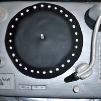 Turntable This was my first non-tiered/traditional cake. Grey fondant painted silver. Gum paste pieces painted silver and written with edible marker...