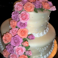 Cascading Roses This cake was the first time I did a stacked cake and gum paste roses. I like how it turned out.