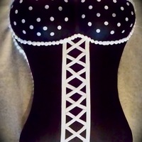 Black And White Corset I made this cake for my boyfriend's birthday. Covered in black fondant. White fondant accents and white buttercream pearls.