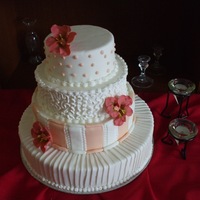 Round Wedding Cake Fondant covered with royal icing piping and fondant flowers.